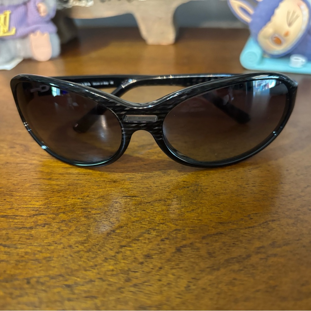 Prada sunglasses in generic case with COA
